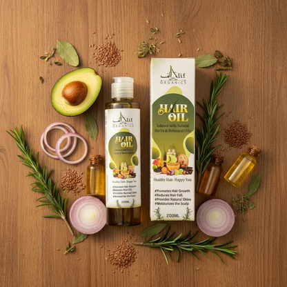 Alif Organics Hair Oil flat lay with natural herbs and botanical ingredients